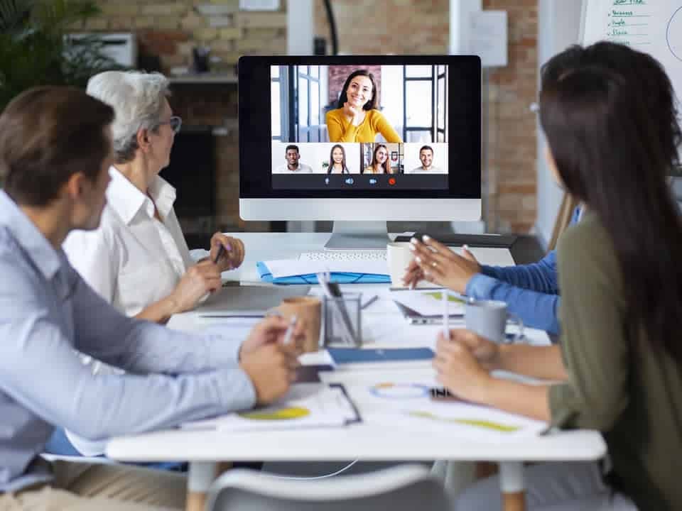 business people using a digital device while in a meeting